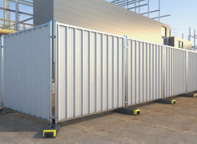 Modular steel hoarding panels with weighted bases forming a temporary site perimeter