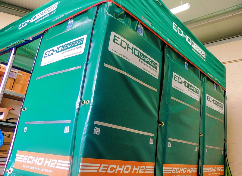 Echo Barrier H2 noise control enclosure with green acoustic panels